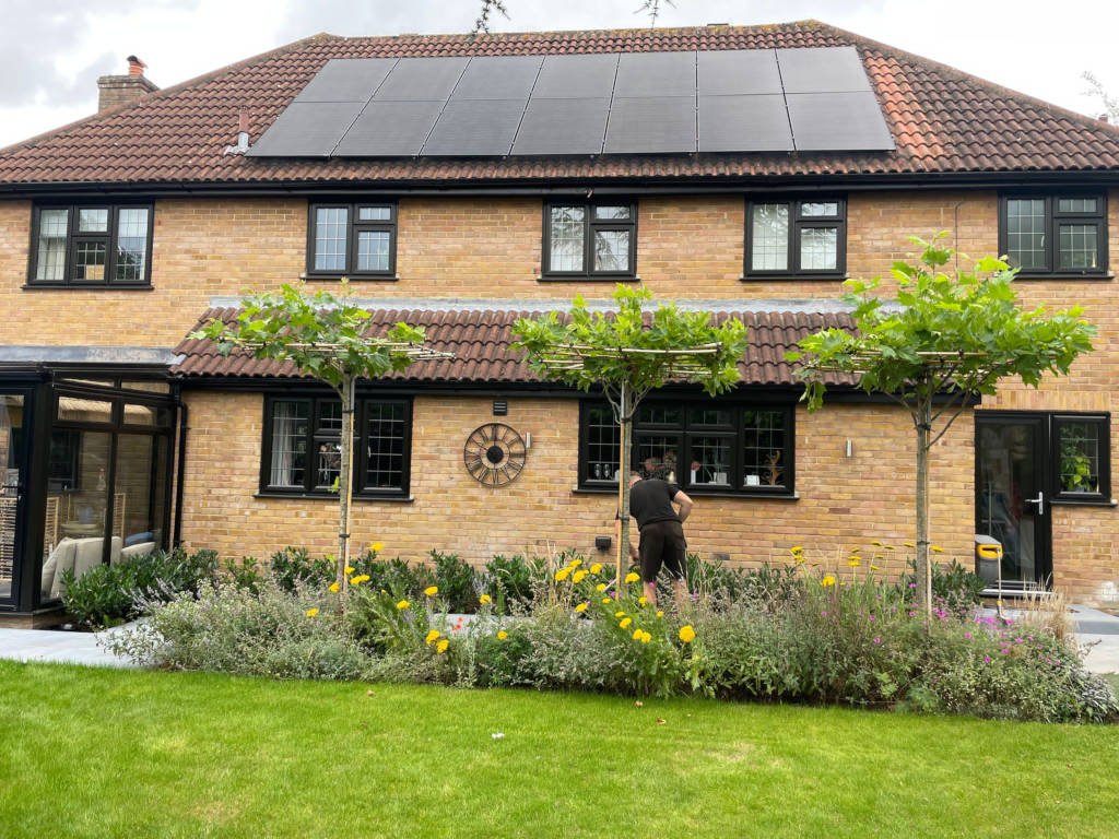 Jinko solar black panels on house roof scaled